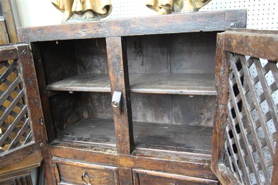 An antique Spanish walnut food cupboard, W.2ft 10in. D.1ft 7in. H.4ft 10in.